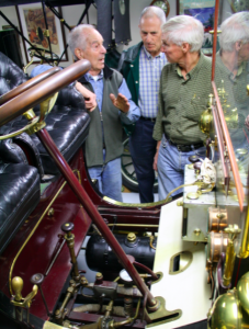 Seen here is Paul Carter explaining the intricacies of operating a White, a car that runs completely on steam!